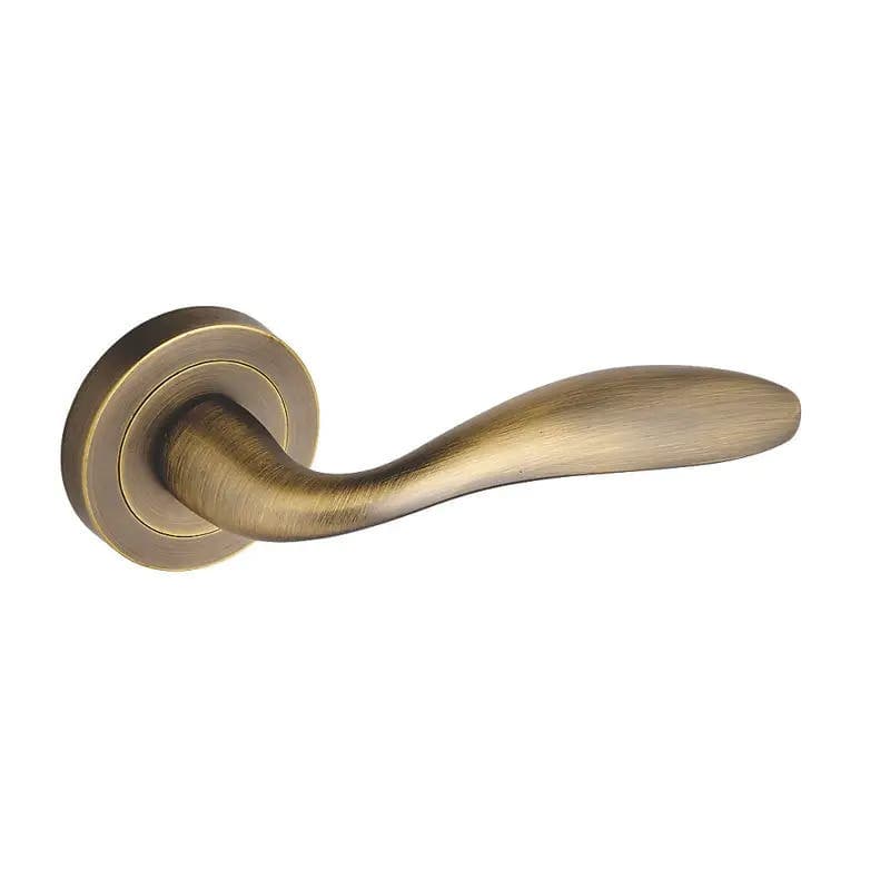 Jasper Curved Lever Door Handle on Rose - Antique Brass - Pair - Designer Levers